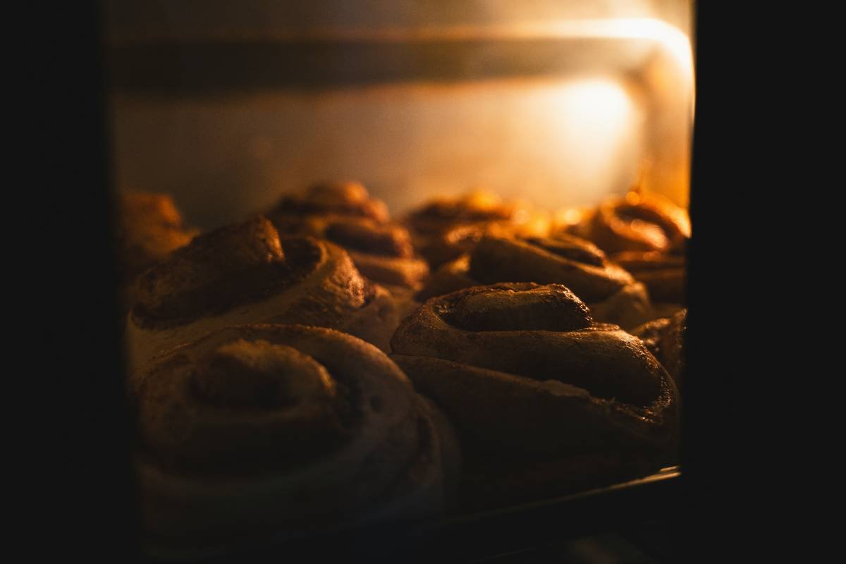 Side-by-side photo: Left shows dense, soggy bread pudding baked conventionally; right shows light, custardy slice made in bread machine with visible custard pooling gently around bread cubes