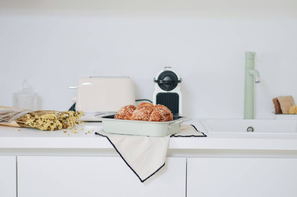 Side-by-side comparison: bread stored in airtight plastic (soggy) vs. breathable cotton bag (crisp crust)