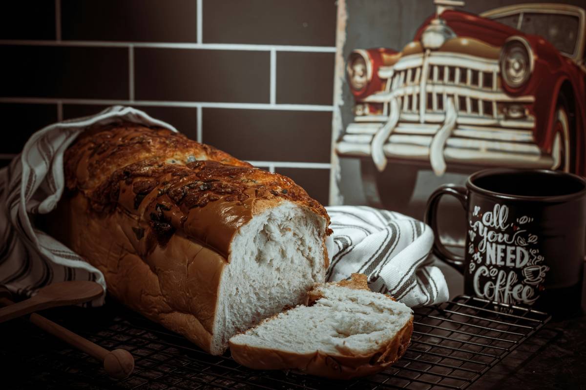 homemade bread for beginners rising in a bread machine pan