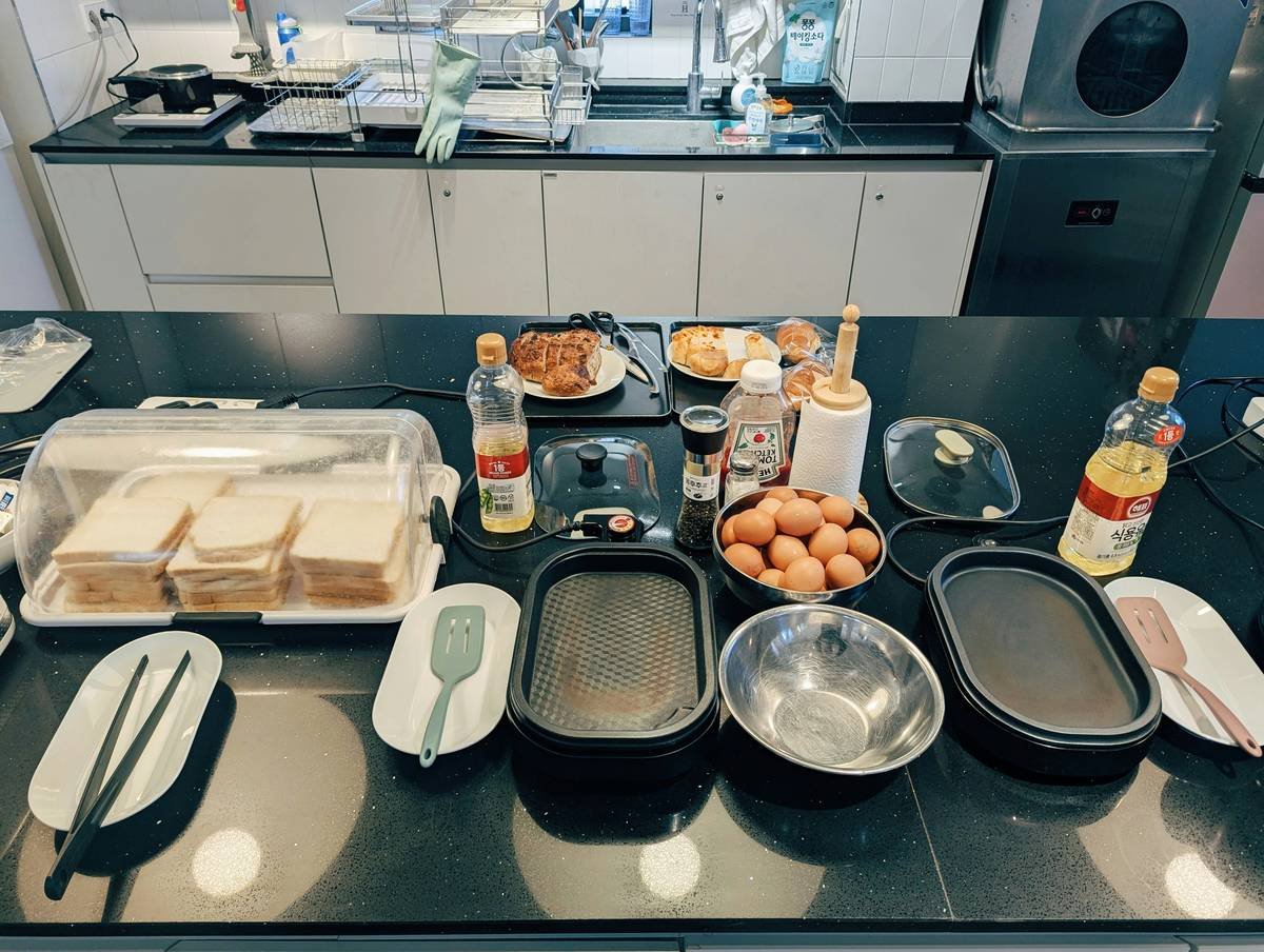 bread making recipes for beginners with bread machine and ingredients laid out on counter